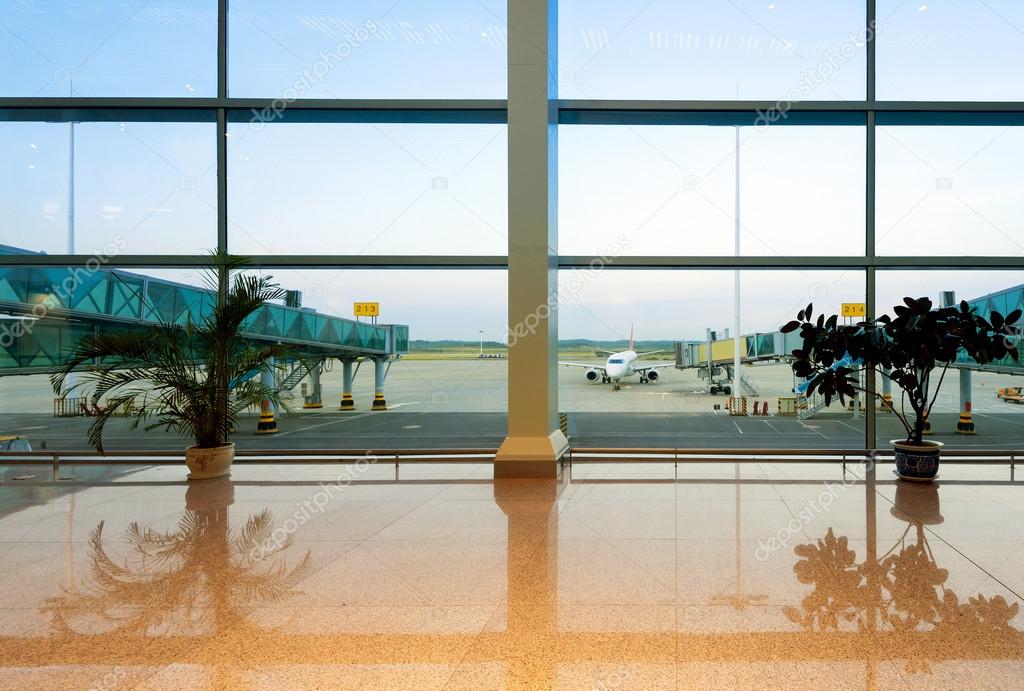 Airports with large windows and aircraft