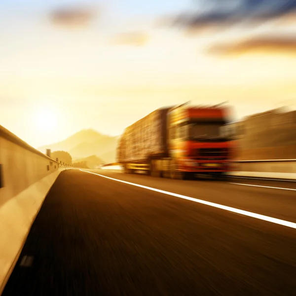 Red truck traveling at high speed — Stock Photo, Image