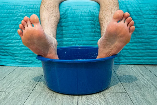 soar your feet in a basin of medicines with a hot solution to avoid colds in the cold season