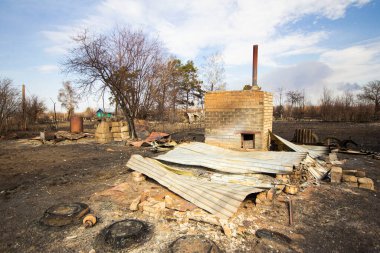 bombed houses in Ukraine during Russian aggression, burnt houses on the outskirts of the city