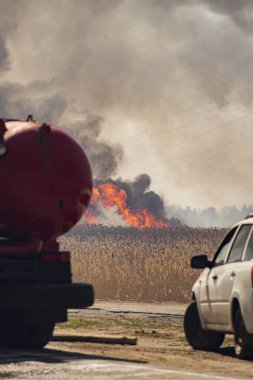 a strong fire near the city, the smoke of the atmosphere with toxic gases from fires