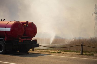 a strong fire near the city, the smoke of the atmosphere with toxic gases from fires