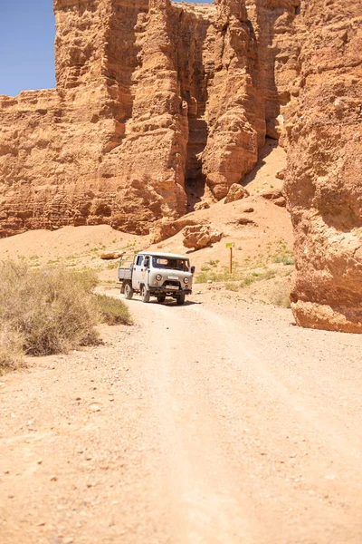 July 6, 2022, kazakhstan, charyn canyon. off-road taxi 4x4 bringing people from the river valley to the plateau