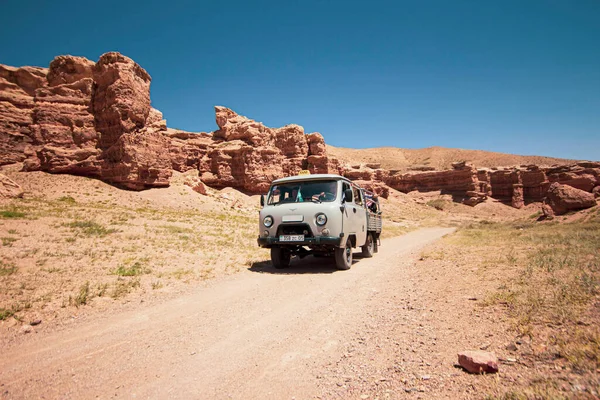 July 6, 2022, kazakhstan, charyn canyon. off-road taxi 4x4 bringing people from the river valley to the plateau