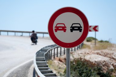 Prohibited overtaking signal on the road clipart