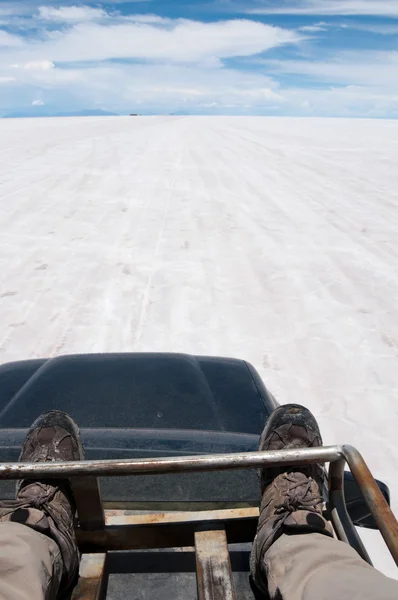 Traveling on a car top, Salar de Uyuni, Bolivia — Stock Photo, Image