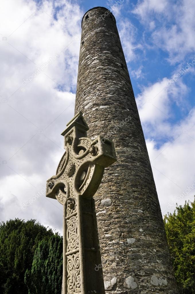 Round tower and celtic cross in Glendalough, Ireland