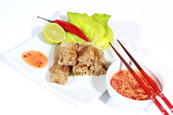 Crispy springrolls on dish with salad — Stock Photo, Image