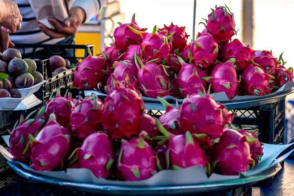 pitahaya fruits on the counter in the market close-up