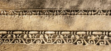 ancient weathered stone-cut ornament on the ruins of a building in the ancient city of Mira, Turkey