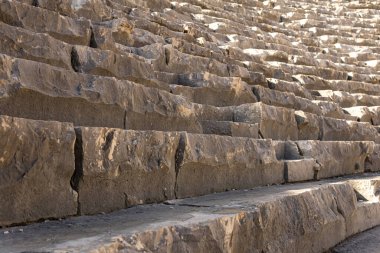 old stone steps - tribunes of an ancient amphitheater 