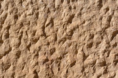 texture of a natural roughly cut stone of some ancient building