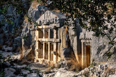 ancient tombs and crypts carved into the rocks in the ruins of Myra of Lycia