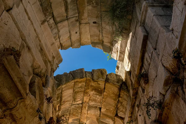 view under the arched vaults of ancient ruins 