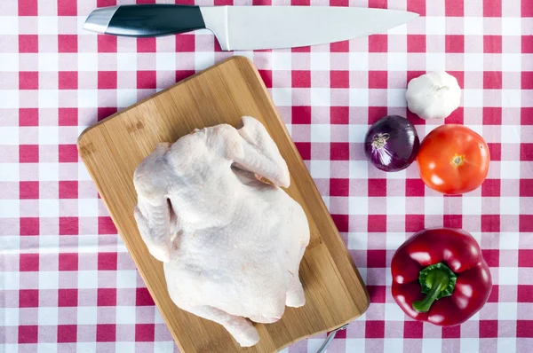 Raw chicken on table — Stock Photo, Image