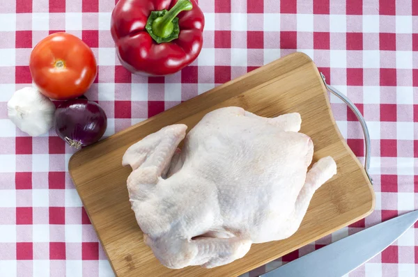 Raw chicken on table — Stock Photo, Image