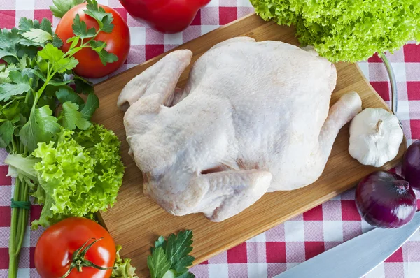 Raw chicken on table — Stock Photo, Image