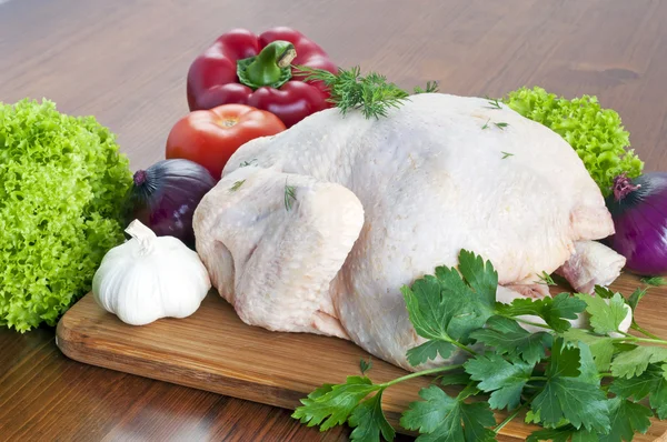 Raw chicken on table — Stock Photo, Image