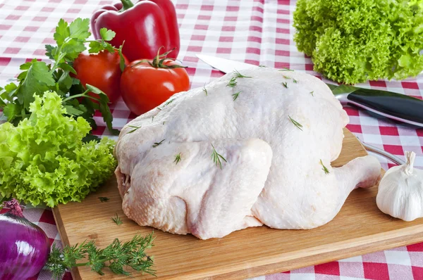 Raw chicken on table — Stock Photo, Image