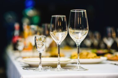 Serving on the table, crystal glasses for wine. Shallow depth of field