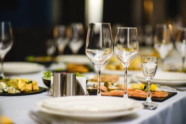 Serving on the table, crystal glasses for wine. Shallow depth of field