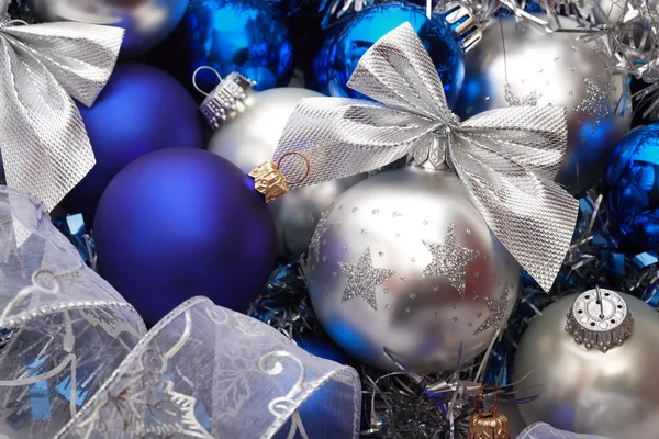 Close-up shot of silver and blue Christmas decorations and tree adornments — Stock Photo, Image