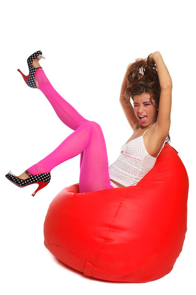 Sexy girl sitting in bean bag