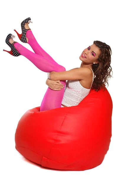 Sexy girl sitting in bean bag — Stock Photo, Image