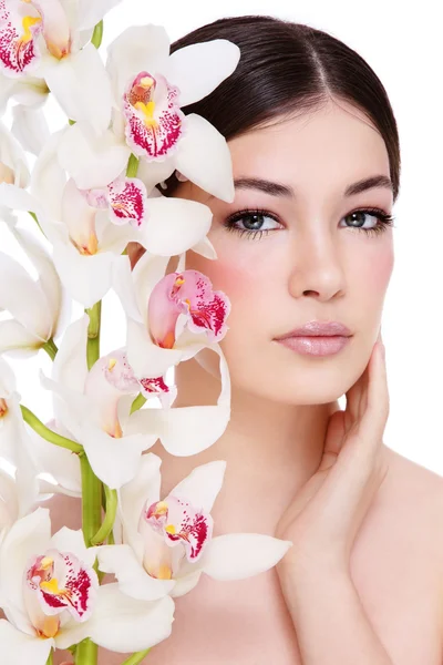 Menina com orquídea branca — Fotografia de Stock