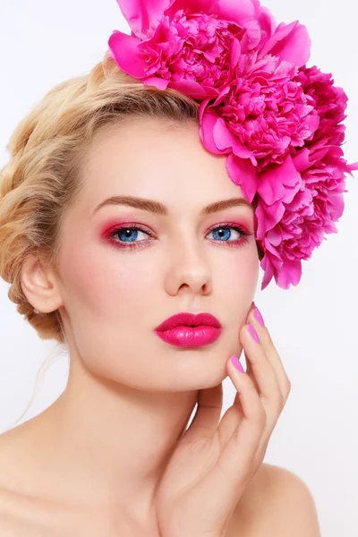 Girl with peonies Stock Picture