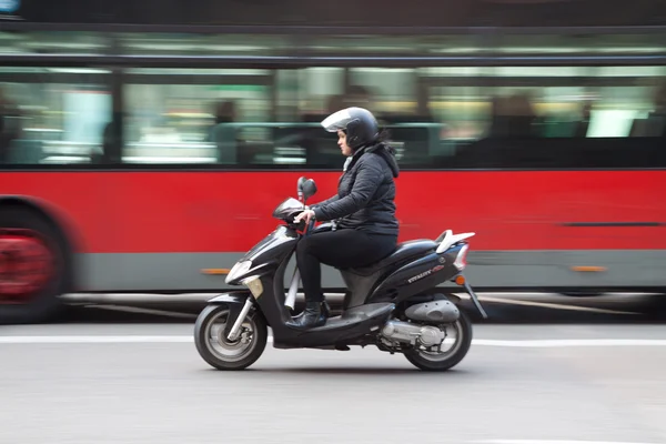 Woman on scooter — Stock Photo, Image