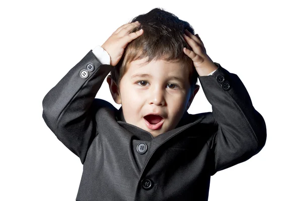 Legrační dítě, dítě oblečený v obleku a kravatu s zábava tvář — Stock fotografie