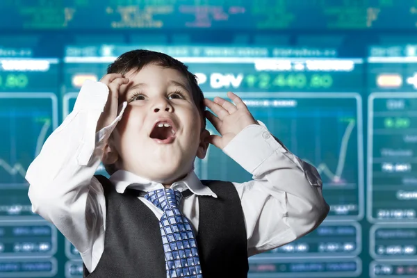 Surprised businessman child in suit with funny face, stock marke — Stock Photo, Image