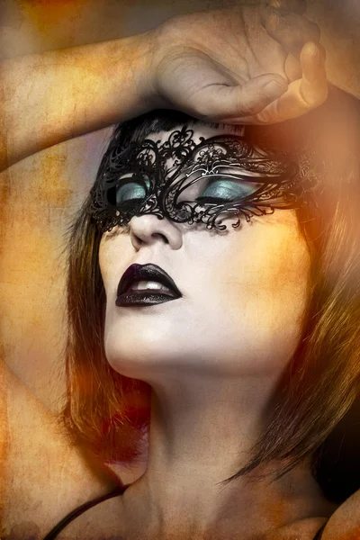 Mysterious naked woman with Venetian mask intense gesture Royalty Free Stock Images