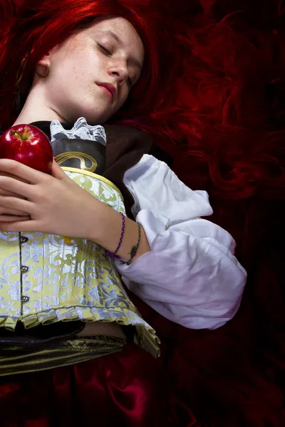 Young woman with red apple in a poetic representation — Stock Photo, Image