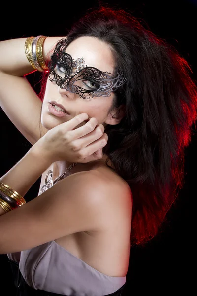 Sexy woman with bracelets of gold and silver, venetian mask with — Stock Photo, Image