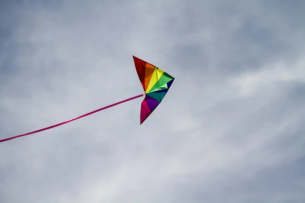 Colorful kite flying in the wind — Stock Photo, Image