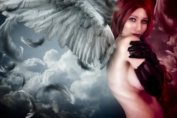 Female angel posing over a cloudy sky — Stock Photo, Image