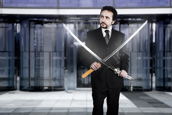 Businessman with two Japanese swords — Stock Photo, Image