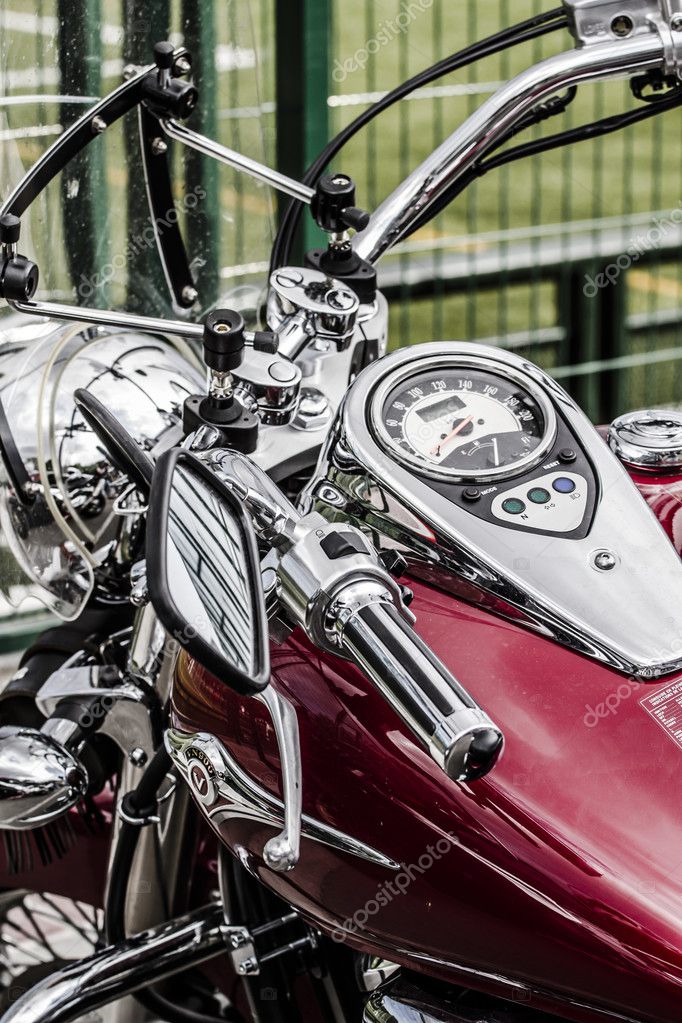 Motorbike's chromed engine. Bikes in a street