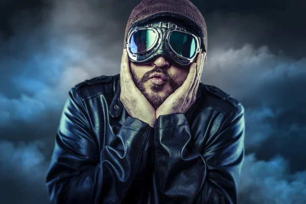 Old pilot with hands on face, funny expression — Stock Photo, Image