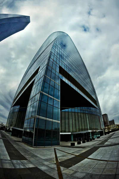 Office glasses, clouds reflect on crystal skyscraper, 8mm lenses — Stock Photo, Image