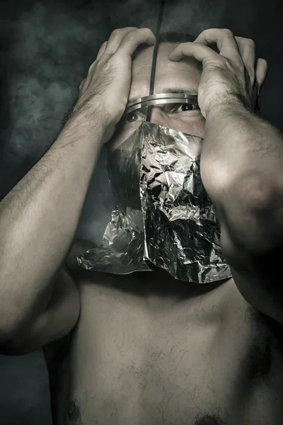 Mist, concept of fear and terror, naked man with hardware in the face — Stock Photo, Image