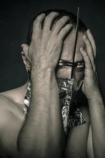 Fight, concept of fear and terror, naked man with hardware in the face — Stock Photo, Image