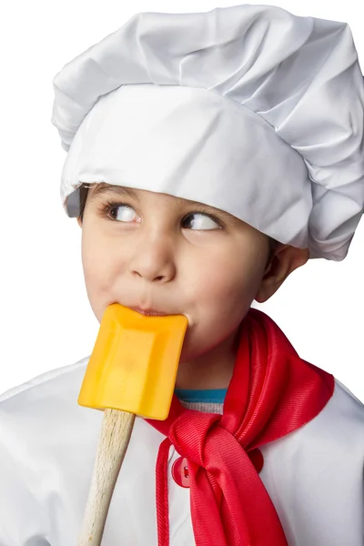 Anak kecil yang terisolasi memasak dengan seragam — Stok Foto