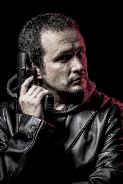 Thief, armed man with black leather jacket, dangerous — Stock Photo, Image