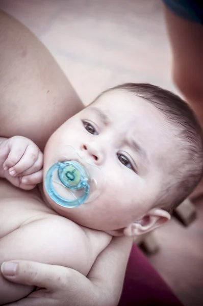 Pacifier, new born baby curled up sleeping on a blanket — Stock Photo, Image