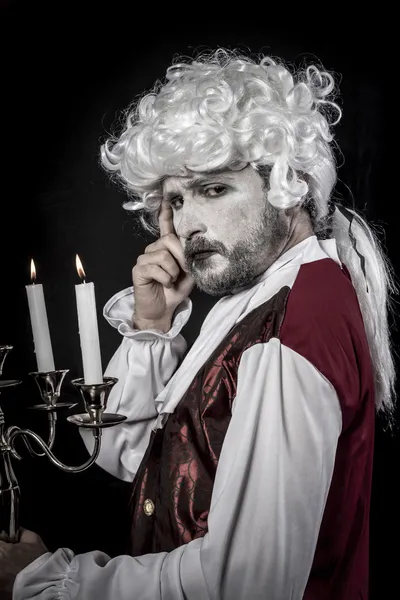 Eighteen era, gentleman rococo wig, candle Stock Picture