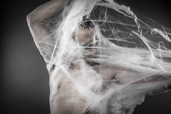 Man tangled in spider web — Zdjęcie stockowe