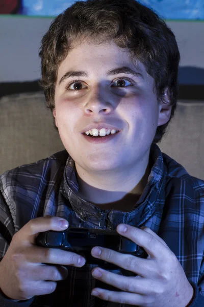 Boy with joystick playing game